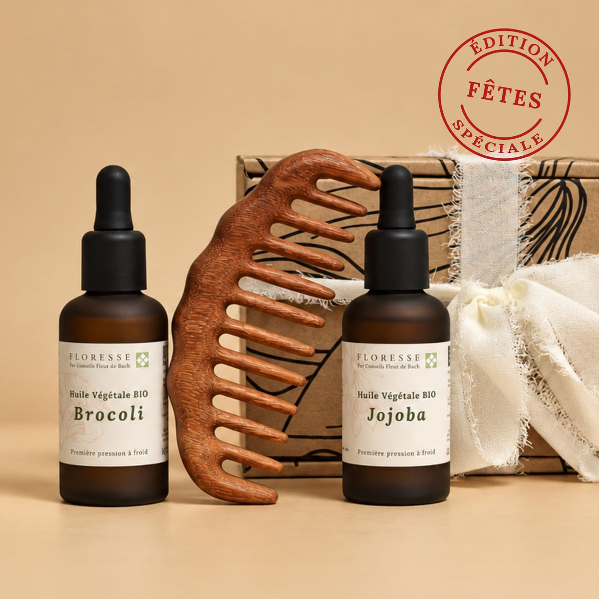 Coffret soin capillaire naturel comprenant l'huile de brocoli, l'huile de jojoba et un peigne en bois.