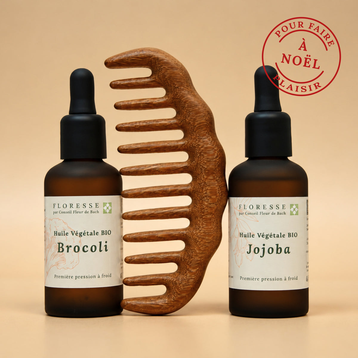 Duo d'huiles végétales bio de brocoli et jojoba accompagnées d'un peigne en bois pour nourrir et gainer les cheveux.