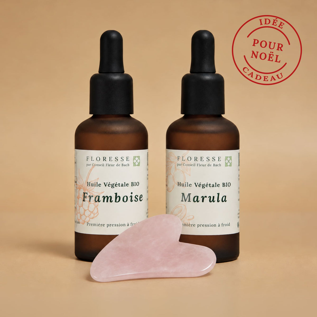 Duo d'huiles végétales bio de marula et pépins de framboise accompagnées du gua sha lissant pour le visage.